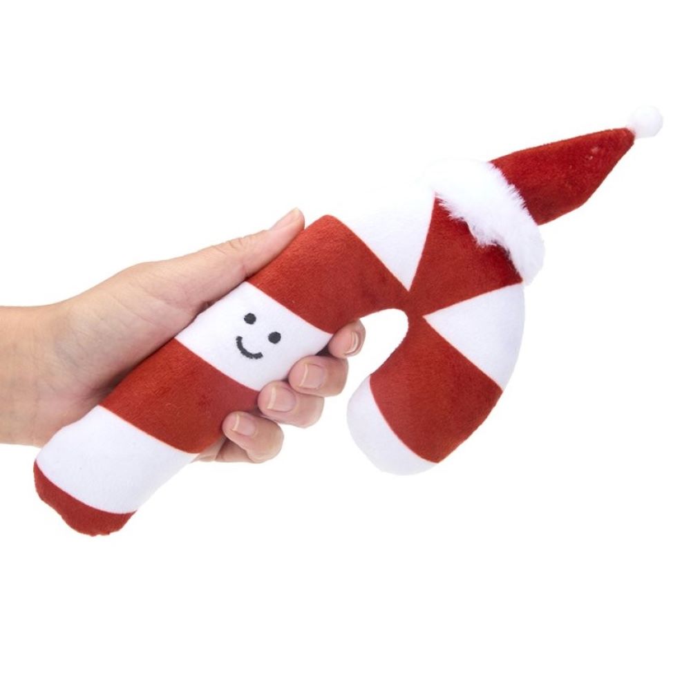 Red and white candy cane-shaped plush toy held by a hand