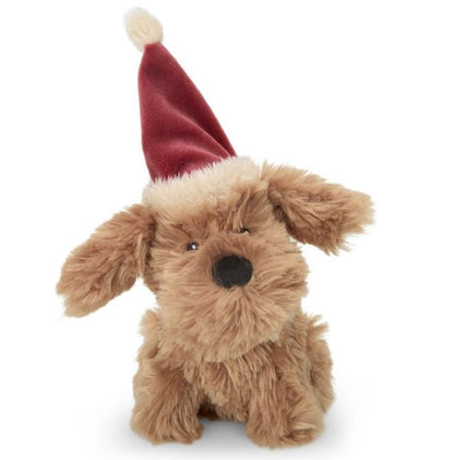 Plush dog toy with a red Santa hat on a white background